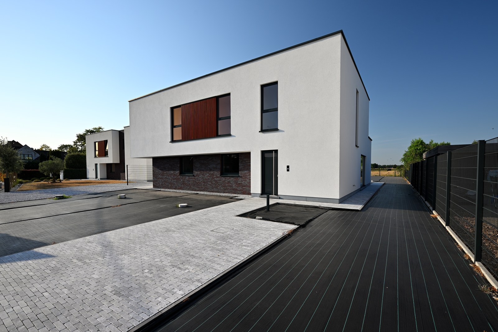 Voorgevel van de halfopen nieuwbouwwoning aan Wachtebekesteenweg 1E